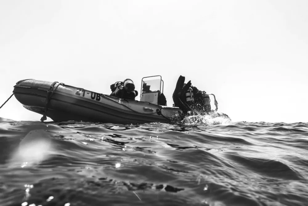 Dive boat and divers in the sea