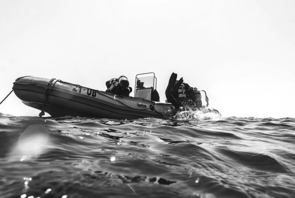 Dive boat and divers in the sea
